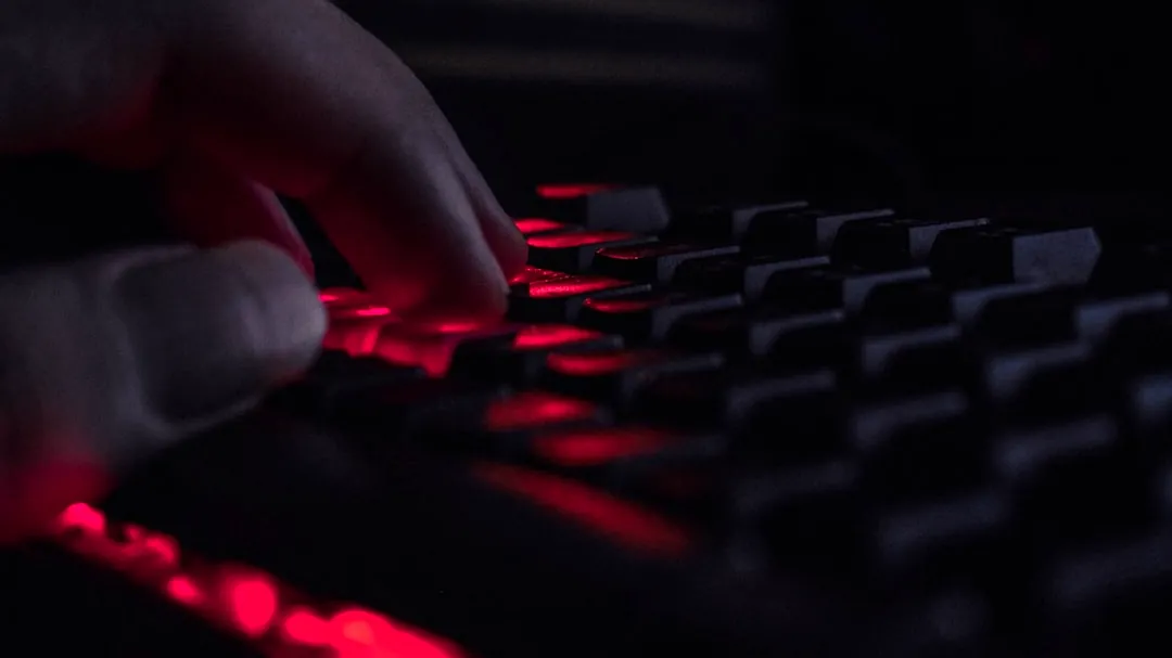 a close up of a person's hand on a keyboard