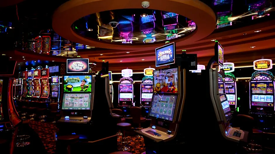 Vibrant casino floor with colorful slot machines and bright lights capturing a lively gaming atmosphere.