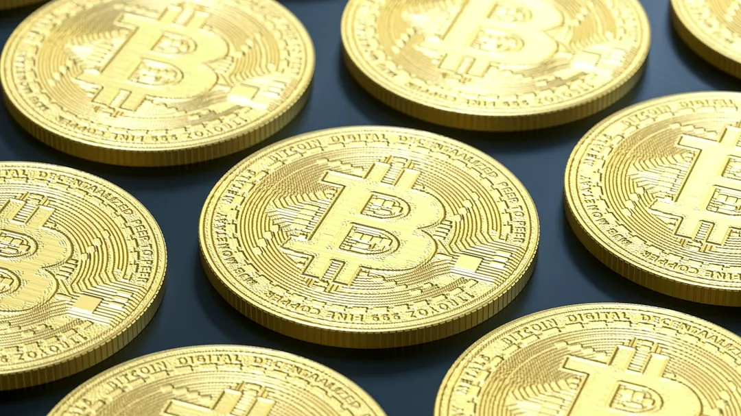 a pile of gold bitcoins sitting on top of a table